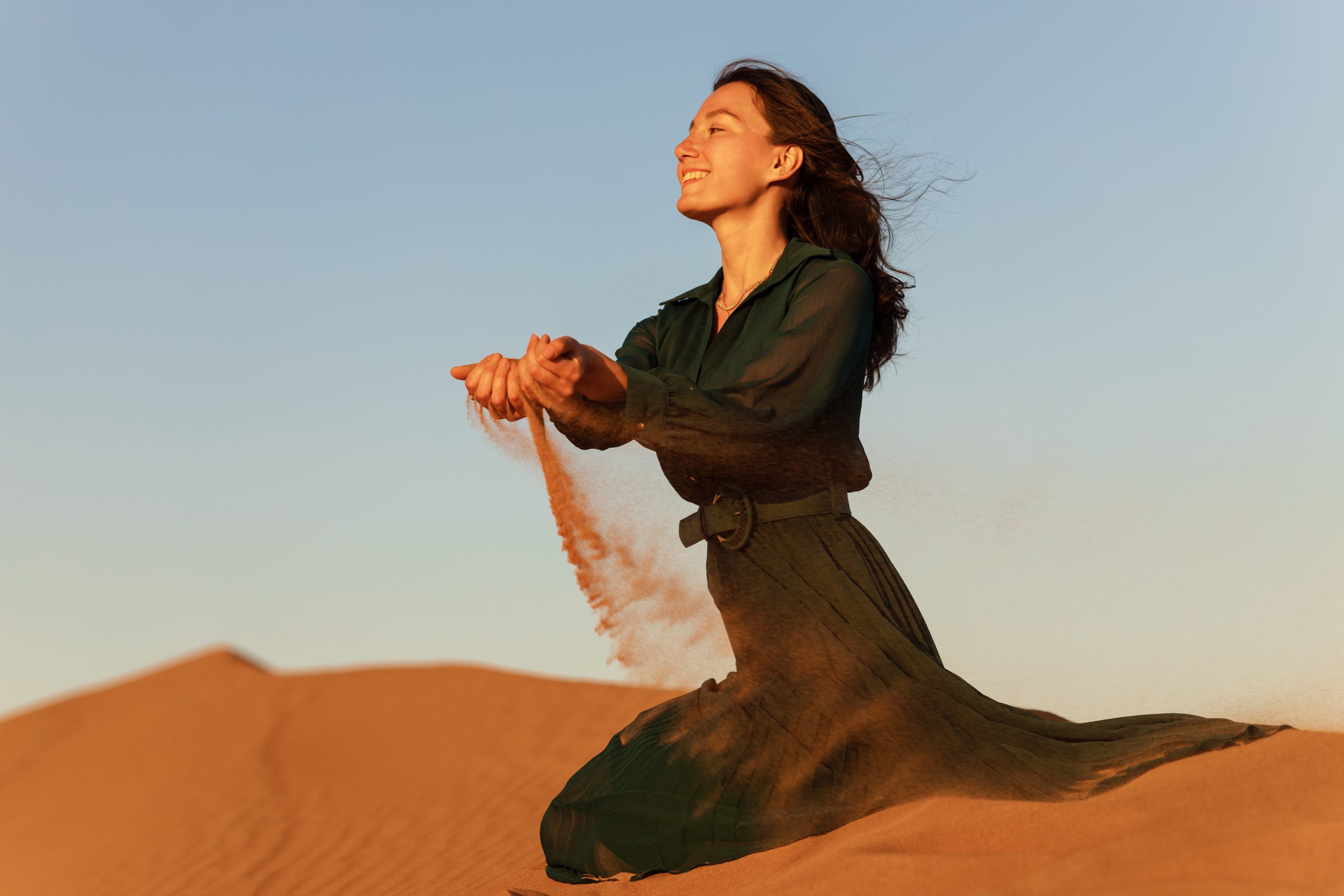 Joyful woman dancing freely in sunlight, celebrating herself