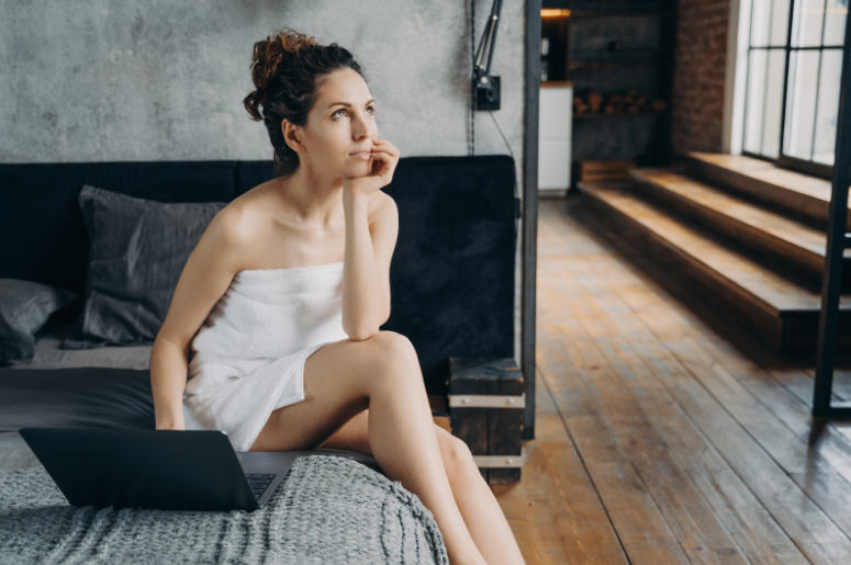 Woman sitting comfortably in a calm indoor setting, representing awareness and understanding of anal itching and intimate health in women